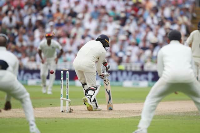 England batsman Adil Rashid is clean bowled by India's Umesh Yadav. Picture: Nick Potts/PA