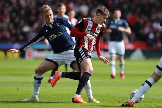 Wanted by Blades and Leeds: Millwall's George Saville, in action against former Sheffield United striker David Brook.