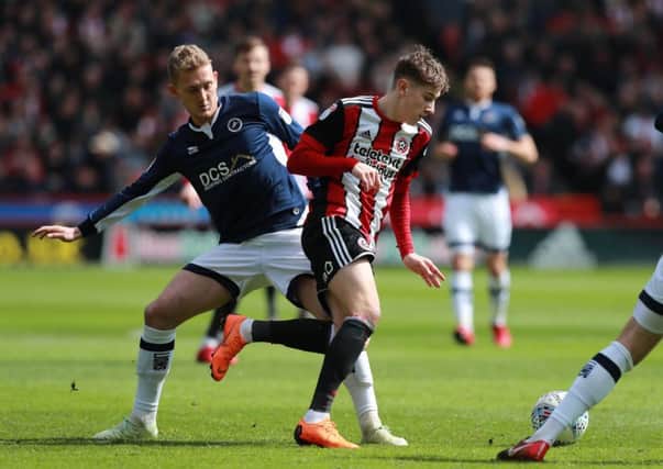 Wanted by Blades and Leeds: Millwall's George Saville, in action against former Sheffield United striker David Brook.