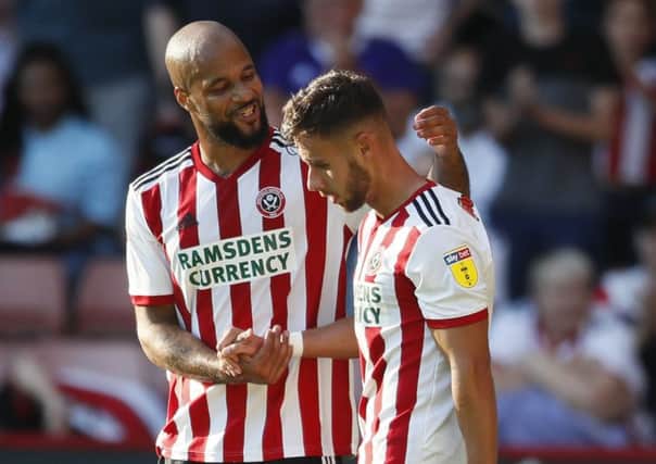 Opener: George Baldock is congratulated by  David McGoldrick after scoring the opening goal. Picture: Simon Bellis/Sportimage