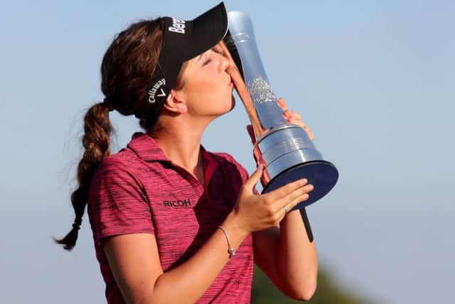 England's Georgia Hall kisses the trophy after she wins the Ricoh Women's British Open at Royal Lytham & St Annes Golf Club. (Picture: Richard Sellers/PA Wire)
