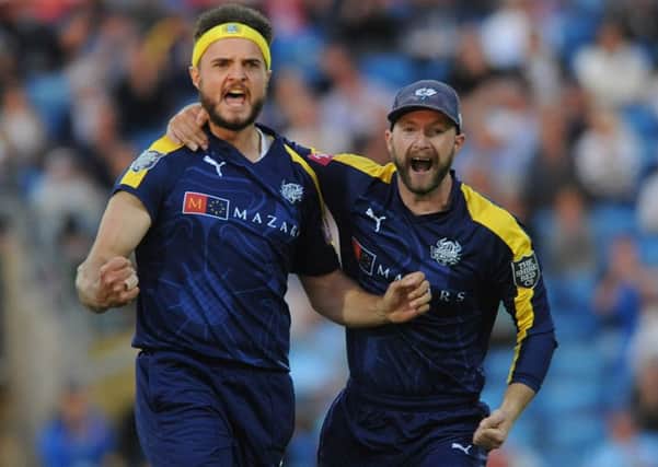 Into action: Jack Brooks and Adam Lyth celebrate against Leicestershire.