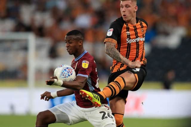 Aston Villa's Jonathan Kodjia and Hull City's Jordy de Wijs battle for the ball during the Sky Bet Championship match at the KCOM Stadium, Hull. (Pictures: Mike Egerton/PA Wire)