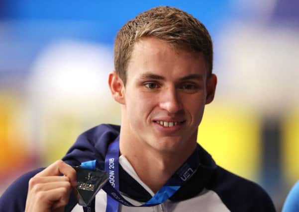 Ben Proud shows off the silver medal he won in the mens 50m butterfly in Edinburgh (Picture: John Walton/PA Wire).