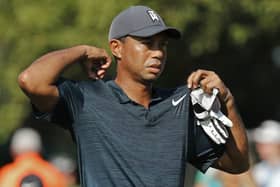 Tiger Woods walks off the 12th tee during the first round of the US PGA Championship in baking hot St Louis (Picture: PA).