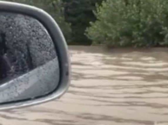 In this image from video, flash floods send a torrent of water down a street in Aubagne, France on Thursday, Aug. 9, 2018. Hundreds of rescuers backed by helicopters evacuated about 1,600 people, most of them campers, in three regions of southern France where heavy rain caused flash flooding and transformed rivers and streams into torrents, the interior minister said Thursday. (Stphane Decoux via AP)