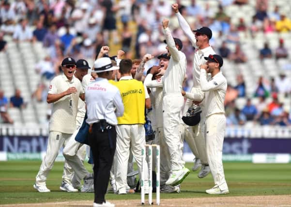 What it's all about: England's Adil Rashid is congratulated by captain Joe Root after taking the wicket of India's Ishant Sharma during day four of the First Test at Edgbaston.