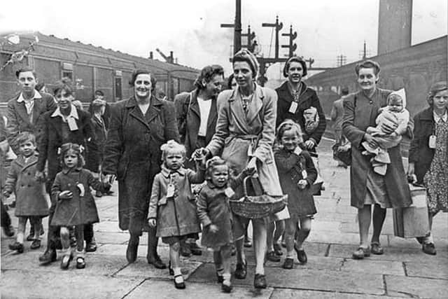 Evacuee mothers and children during the Second World War arrive at Victoria station.