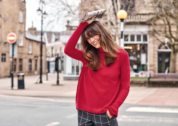 Photographed on the streets of Harrogate, the autumn/winter 2018 new designs from Pure Collection. Ultra soft merino polo sweater in pillar box red (also in heather dove, merlot, teal and black), Â£99; tailored slim-leg trouser in black window pane check (also in navy), Â£99. At Purecollection.com. Photographer  Colette De Barros