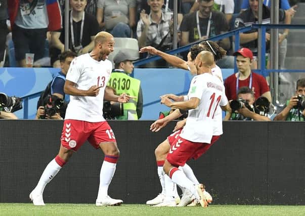 Denmark's Mathias Jorgensen, left, celebrates with teammates after scoring his side's first goal aganst Croatia in the World Cup.