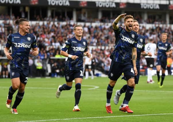 Mateusz Klich, second right, celebrates scoring Leeds United's first goal in the 4-1 victory at Derby County (Picture: Jonathan Gawthorpe).