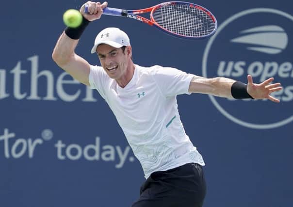 Britain's Andy Murray returns on his way to defeat against Lucas Pouille, of France, in the first round of the Western & Southern Open (Picture: John Minchillo/AP).