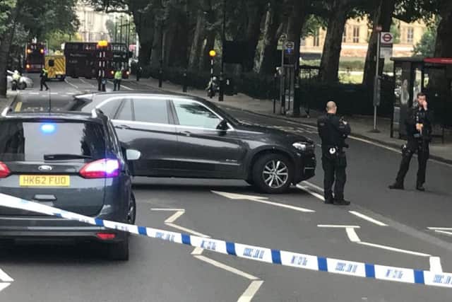Police activity on Millbank, in central London, after a car crashed into security barriers outside the Houses of Parliament.Sam Lister/PA Wire