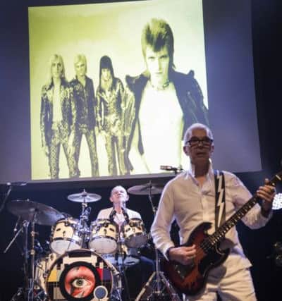 Woody Woodmansey and Tony Visconti on stage with Holy Holy.