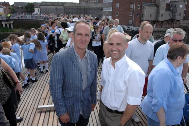 3rd July  2008. Pictured from left Kevin McCloud from tv series Grand Designs and bridge designer Renato Benedett on the new bridge that crosses the river Aire at Castleford. PICTURE GERARD BINKS