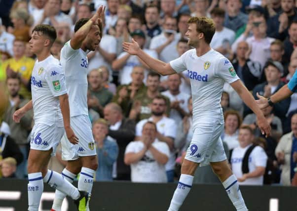 Patrick Bamford celebrates his opening goal for Leeds.
 (Pictures: Bruce Rollinson)