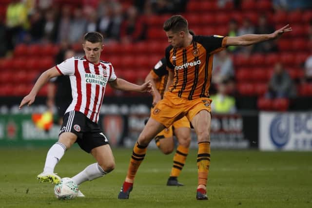 Ben Woodburn of Sheffield United takes on Reece Burke of Hull City during the Carabao Cup 1st Round match at the Bramall Lane Stadium, Sheffield. (Picture: Simon Bellis/Sportimage)