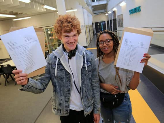 A-Level results day 2018 at UTC Sheffield City Centre. Pictured are Frazer McLean and Charlotte Cass