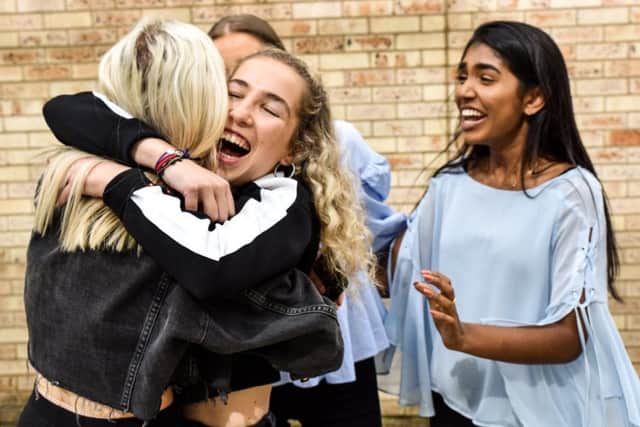 Issy Armstrong, an 'A' level pupil at The Grammar School at Leeds,  celebrates her results with her friends