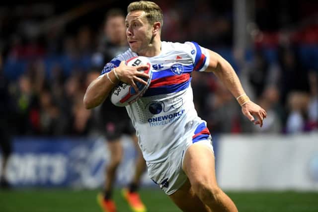 Wakefield's Kyle Wood scores his side's first try.