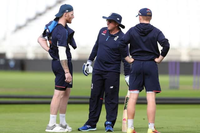 England's Ben Stokes (left) speaks to head coach Trevor Bayliss (centre) during the nets session at Trent Bridge.