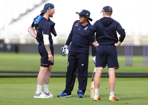 England's Ben Stokes (left) speaks to head coach Trevor Bayliss (centre) during the nets session at Trent Bridge.