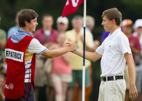 Alex Fitzpatrick, left, who is now in the US Amateur last eight, congratulates his brother Matt, right, for winning the title five years ago when he served as his caddy (Picture: USGA)