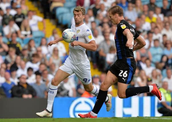 Patrick Bamford and Sean Raggett close in on a long ball.  Picture Bruce Rollinson