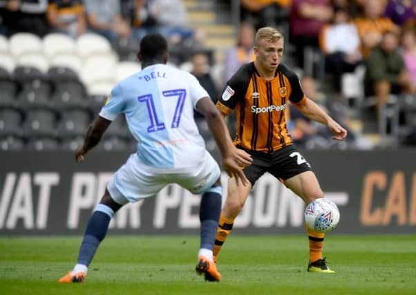 Blocked: Hull's Jarrod Bowen collects the ball infront of Amari'i Bell, of Blackburn Rovers.