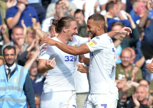 Scorers: Luke Ayling celebrates his goal with Kemar Roofe, who scored the second for Leeds.  Picture: Bruce Rollinson