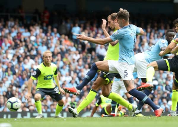 Huddersfield Town's Jon Gorenc Stankovic scores his side's first goal of the game at the Etihad Stadium, Manchester. (Picture: PA)