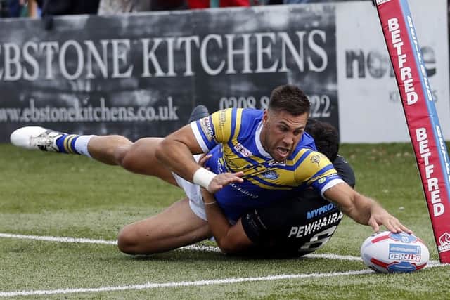 Hat-trick: Joel Moon touches down on his way to a hat-trick of tries as Leeds Rhinos beat London Broncos in their Qualifiers match. (Picture: Max Flego/RLPhotos)