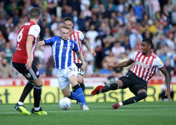Sheffield Wednesday substitute Frazer Preston tries to overcome the odds in midfield against Brentford (Picture: Steve Ellis).