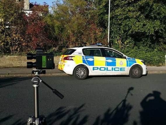 Police operating a speed gun in West Yorkshire