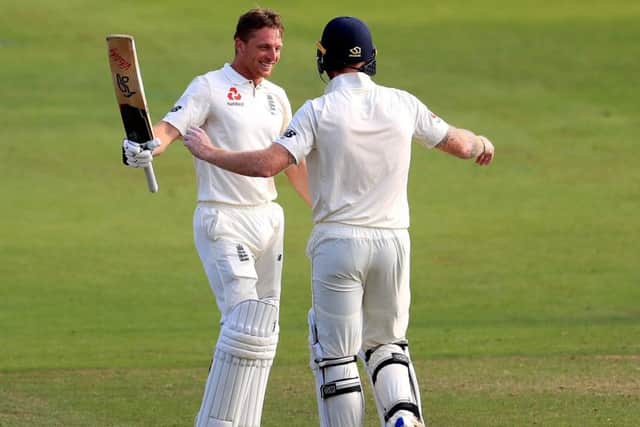 England's Jos Buttler (left) celebrates reaching his century with Ben Stokes at Trent Bridge. Picture: Mike Egerton/PA