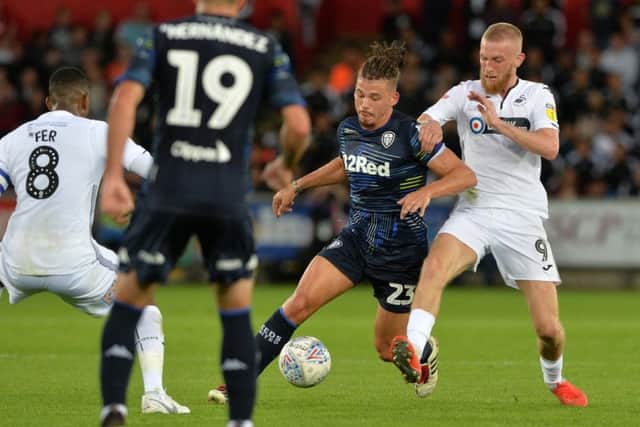 Kalvin Phillips is held back by Oli McBurnie.  Picture: Bruce Rollinson