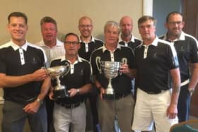 Lindrick's 8215 captain Dave Hall, far right front row, with his double-winning side including, holding the trophies, l-r, Kevin Osbourne, Mark Roberts and Neil Beavers.