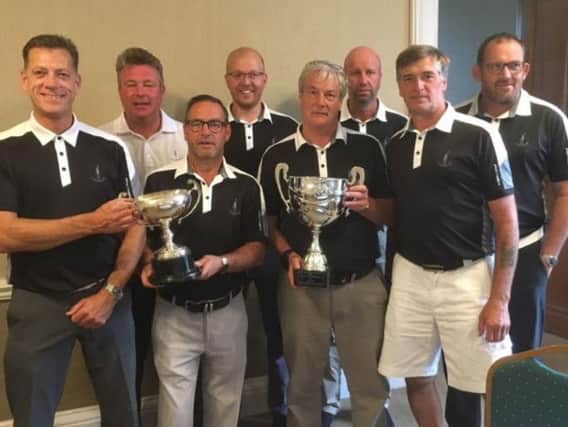 Lindrick's 8215 captain Dave Hall, far right front row, with his double-winning side including, holding the trophies, l-r, Kevin Osbourne, Mark Roberts and Neil Beavers.