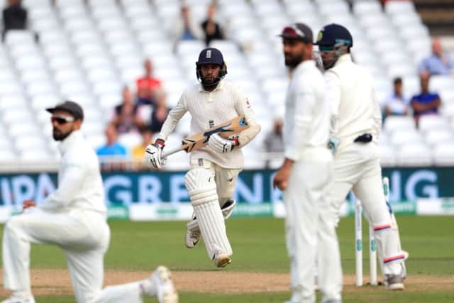 England's Adil Rashid adds runs in England's forlorn chase. Picture: Mike Egerton/PA