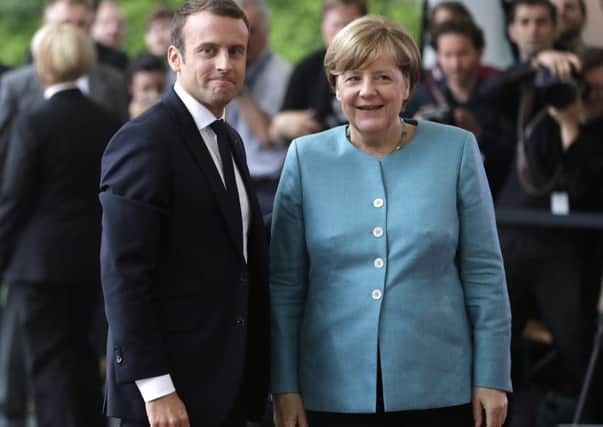 Emmanuel Macron and Angela Merkel are both having to contend with rising extremism by the far-right in France and Germany respectively.