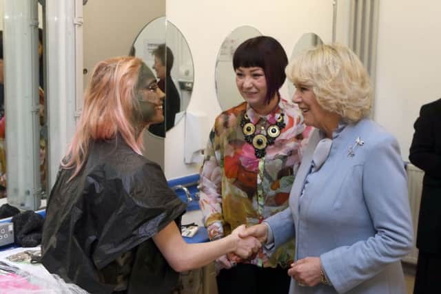 The Duchess of Cornwall meets student Amber Sanson-English during her visit to the Brit School for Performing Arts.