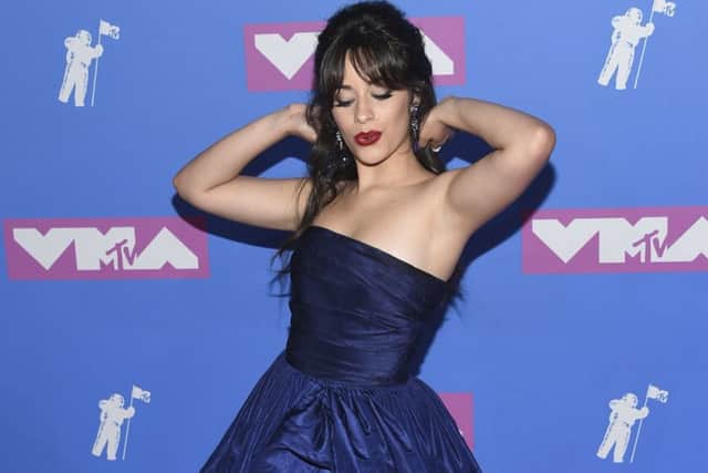 CELEB GET THE LOOK: Singer-songwriter Camila Cabello steps out for the MTV Video Music Awards this week in New York, made up in classic glamour girl glory with flicked lashes and matte ruby pout. For the lips, try MAC Lip Duo in Ruby Woo, now Â£27 at Debenhams.
. (Photo by Evan Agostini/Invision/AP)