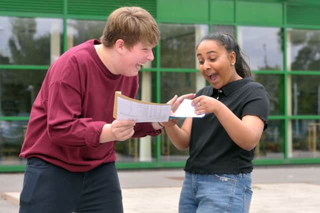 23 August  2018......     Students Henry Steel-Childe and Neelam Roth celebrate their GCSE results at Allerton High School. Picture Tony Johnson.
