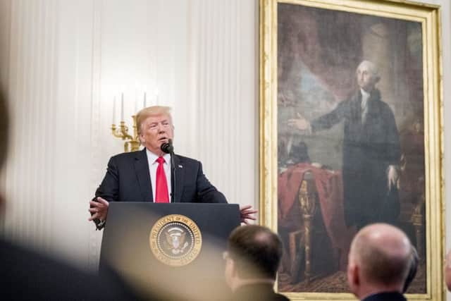 President Donald Trump speaks before presenting Valerie Nessel the Medal of Honor for her husband Air Force Tech. Sgt. John A. Chapman, posthumously for conspicuous gallantry, during a ceremony in the East Room of the White House in Washington, Wednesday, Aug. 22, 2018. (AP Photo/Andrew Harnik)