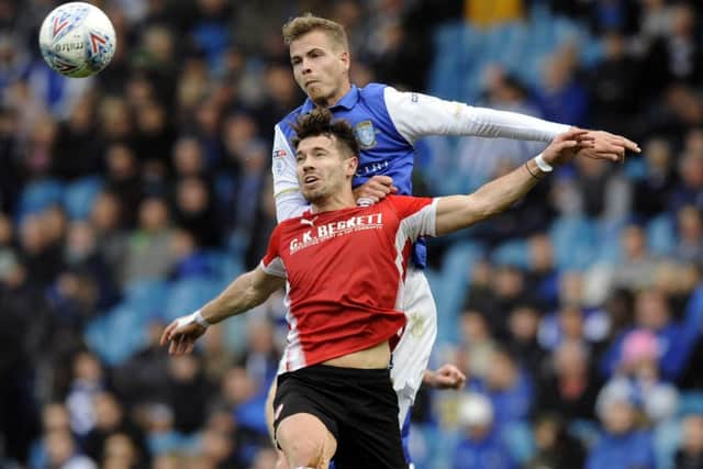 MOVING ON: Barnsley's Tom Bradshaw, in action against Sheffield Wednesday last season. Picture: Steve Ellis