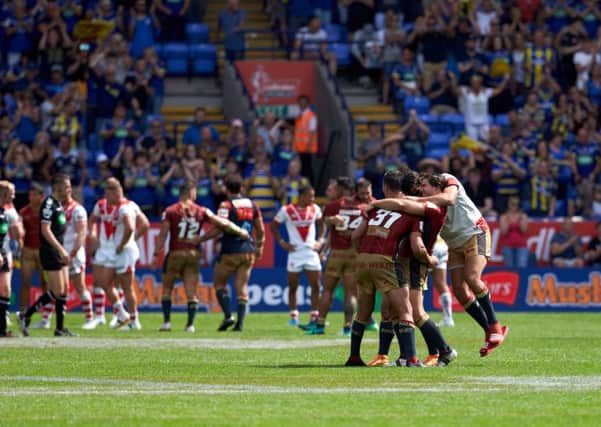 YES!! Catalans Dragons celebrate victory against St Helens in the Challenge Cup semi-final at the Macron Stadium. Picture: Shaun Flannery/SWpix.com