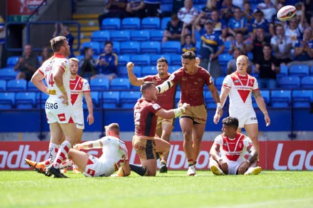 Catalans Dragons' players celebrate a try in the semi-final against St Helens. Picture: Shaun Flannery/SWpix.com