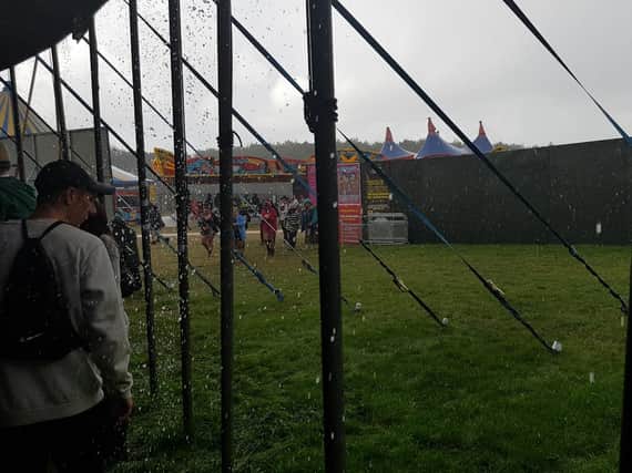 Torrential downpours force people to run for cover at Leeds Fest