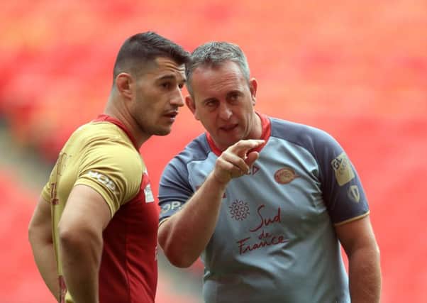 Catalan Dragons' Coach Steve McNamara (right) during the captain's run at Wembley Stadium yesterday. Picture: Adam Davy/PA