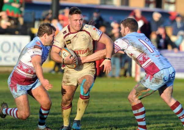 Old feelings: Will Owen, centre, playing for Doncaster Knights against his former club Rotherham Titans last season just a few weeks before he suffered a knee injury that eight months later he is still to fully recover from. (Picture: Tony Johnson)